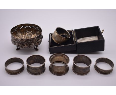 A cased silver napkin ring; together with three other similar examples; an Indian white metal bowl etc, 44g weighable. (7) 