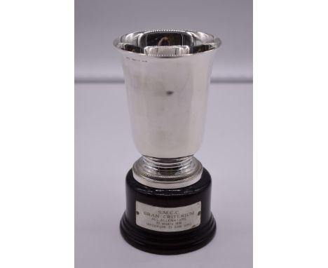 An Italian white metal trophy cup, by R Miracoli, stamped 800, on wood socle, 18cm total height. 