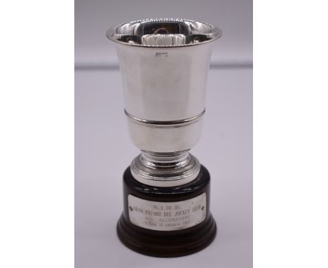 An Italian white metal trophy cup, by R Miracoli, stamped 800, on wood socle, 16.5cm total height. 