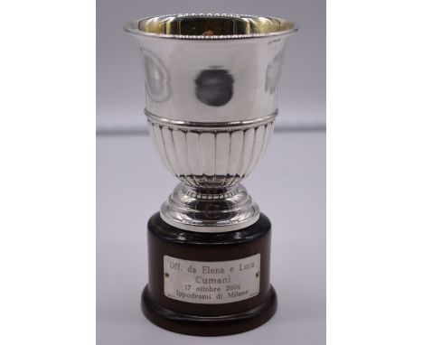 An Italian white metal trophy cup, by R Miracoli, stamped 800, on wood socle, total height 18cm. 