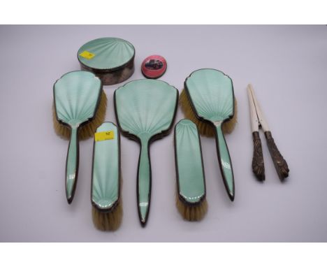 A six piece silver and green enamel dressing table set, by Wilson &amp; Gill, Birmingham 1936; together with a silver and pin