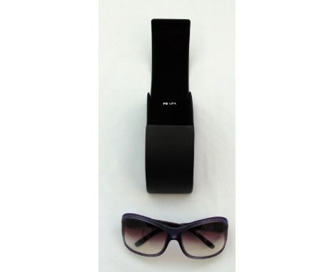 A pair of Prada sunglasses SPR05L 61017 720-4UI 1252N in original case