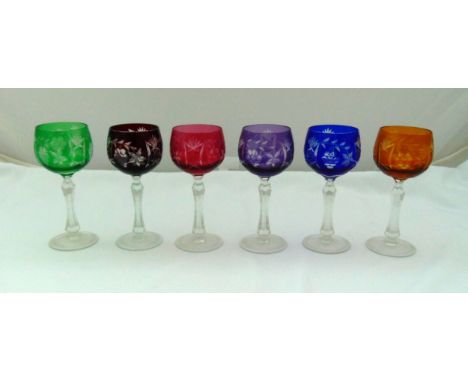A set of six cut glass coloured hock glasses on circular spreading bases