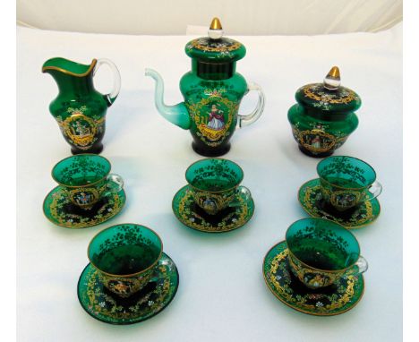 A continental green glass coffee set decorated with hand painted images and gilding to include a coffee pot, a cream jug, a s