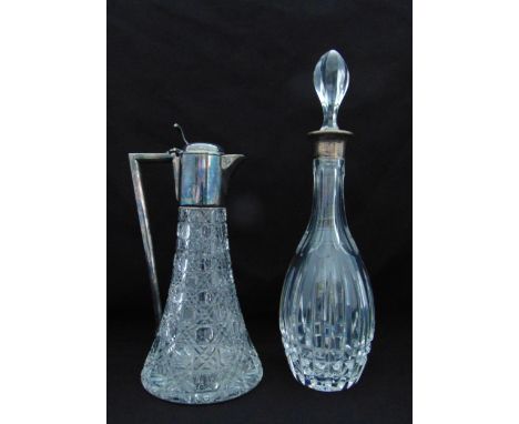 A hallmarked silver and cut glass claret jug, London 1979 and a cut glass decanter with drop stopper and hallmarked silver co