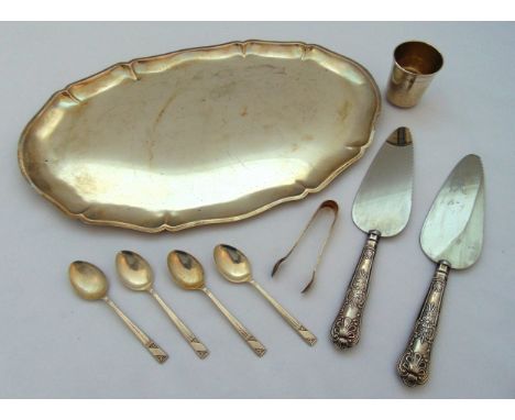 A quantity of hallmarked silver and white metal to include a Kiddush cup, four teaspoons, a pair of sugar tongs, two cake sli