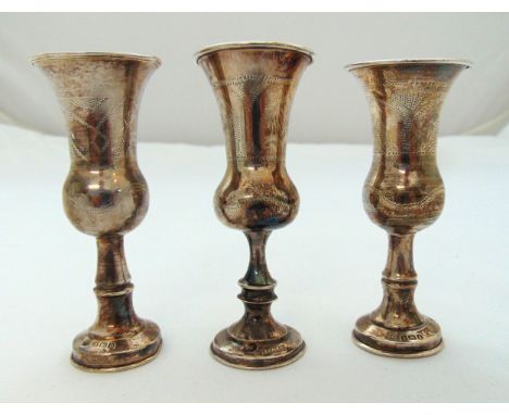 Three hallmarked silver Kiddush cups, of customary form, approx total weight 84g