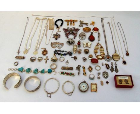 A quantity of silver and costume jewellery to include a Tiffany style bracelet, a Gucci ring, amber pendants and brooches, a 