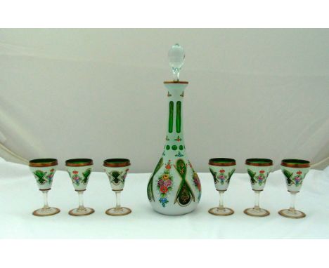 A continental opaline overlaid green glass decanter with drop stopper and six matching liqueur glasses