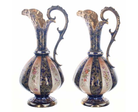 Good pair of Thomas Forrester &amp; Sons Limited pottery ewers, decorated with alternating gilt on enamel blue and floral on 