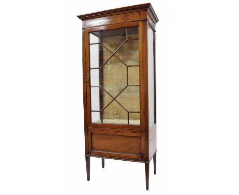 Edwardian mahogany inlaid display cabinet with a single astragal glazed door over a drop front cabinet and upon square taperi