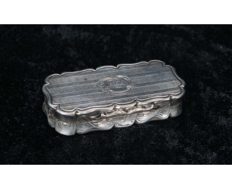 Victorian silver vinaigrette, the shaped cover with engine turned decoration around a monogrammed cartouche, enclosing a gilt