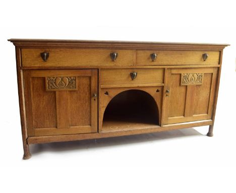 Interesting Arts &amp; Crafts large oak sideboard, the moulded top over two long drawers and a short central drawer all fitte