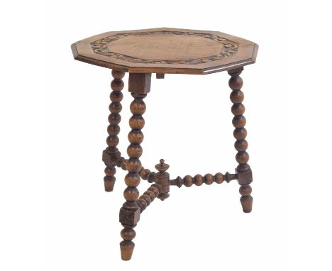 Oak nonagon bobbin turned side table, the moulded top with relief carved foliate scrolling border raised upon three bobbin tu