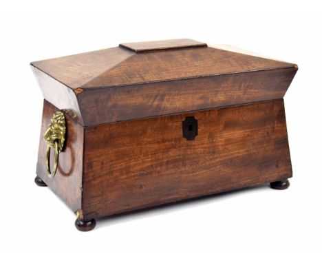 Victorian mahogany sarcophagus&nbsp;tea caddy, with twin lions head ring handles, the hinged cover enclosing two covered comp