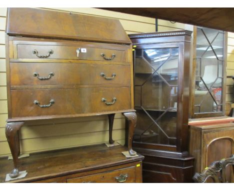 Mahogany three drawer bow front bureau, standing corner cupboard and a wall hanging corner cupboard
