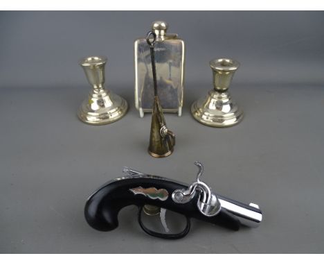 Silver hip flask and two squat candlesticks, a plated candle snuffer and a vintage flintlock pistol tale lighter