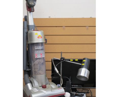 Small screen Akura LCD TV, VAX Power 3 upright vacuum cleaner and a small black and chrome desk lamp E/T