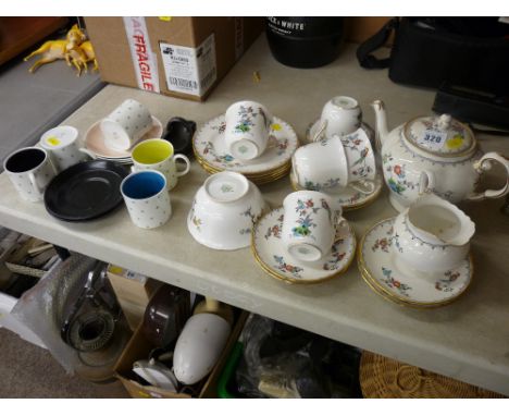 Tuscan bone china part teaset with teapot and a quantity of Susie Cooper designed coffee cans and saucers