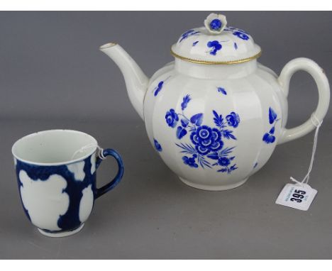 First period Worcester James Giles dry blue decorated teapot and a part decorated cup with blue scale ground, both with under