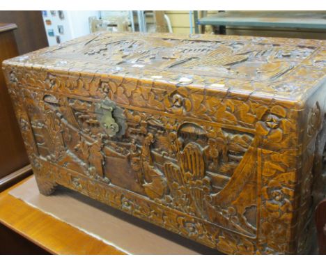 Oriental heavily carved camphor wood trunk