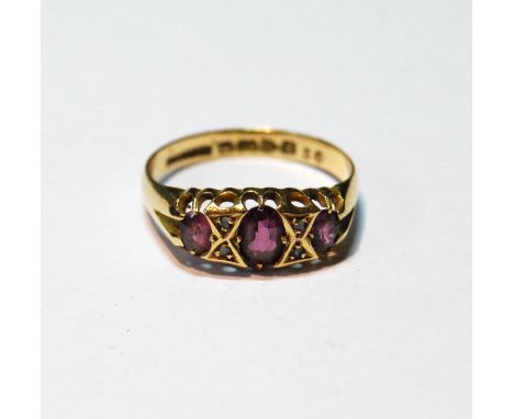18ct gold ring with three amethysts and diamond points, Chester 1912, size Q, 3g. 