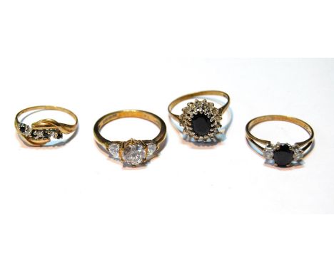 Cubic zirconia three-stone ring and three others, 9ct gold, 7.9g. 