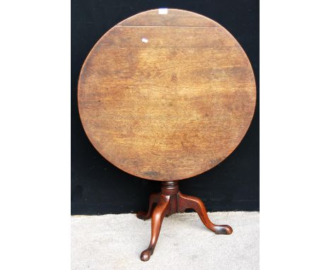 George III mahogany birdcage tilt-top table, the circular top raised on tapering turned support, cabriole tripod legs termina