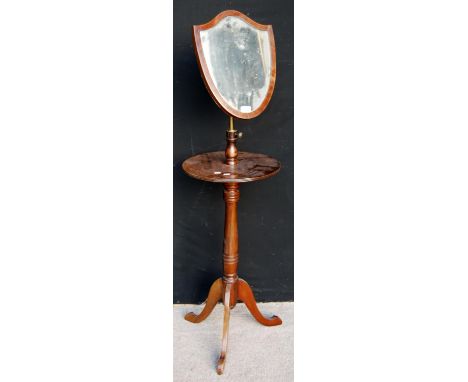 Edwardian mahogany shaving mirror and stand with shield-shaped mirror, circular top, baluster column and tripod legs, 42cm di