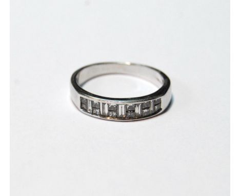 Diamond half eternity ring, princess and baguette-cut, in 18ct white gold, size L, 2.7g. 
