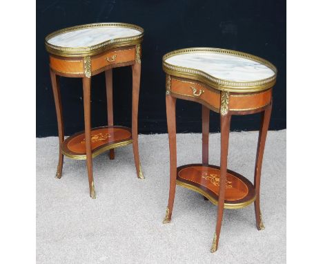 Pair of king wood kidney-shaped side tables, each with brass gallery, marble top, frieze drawer, brass mounts, sabre legs uni