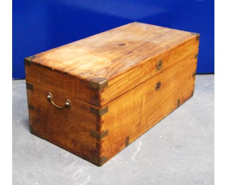 Brass-bound camphorwood trunk of rectangular form with flush frieze handles, 70cm wide, 31cm high and 35cm deep. 