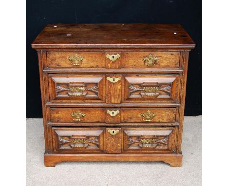 Queen Anne oak chest, the rectangular top over four panelled graduated drawers raised on bracket feet, 98cm wide, 86cm high a