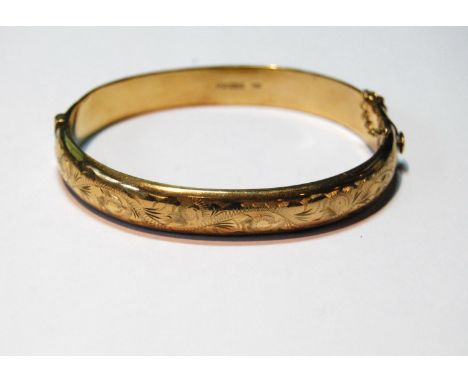 9ct gold hinged bangle, half-engraved, 13g. 