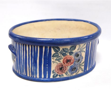 Studio pottery planter&nbsp;of oval form&nbsp;decorated by Ann McBeth with blue stripes and foliate panels, signed to the bas