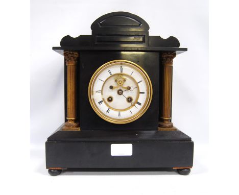 Late Victorian slate mantel clock of Palladian form with white enamel chapter ring, Roman numerals, flanked by Corinthian col