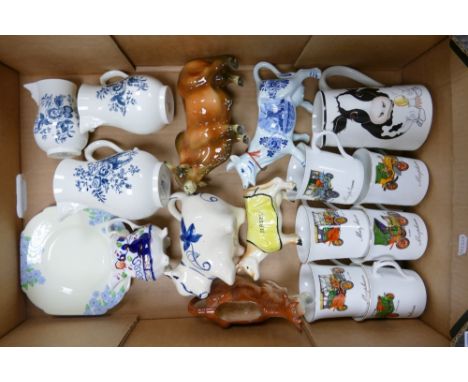 A Mixed Collection of Ceramic Items to include Royal Worcester Blue Sprays Graduated Jugs, Cow Themed Jugs and Pourers, Sprin