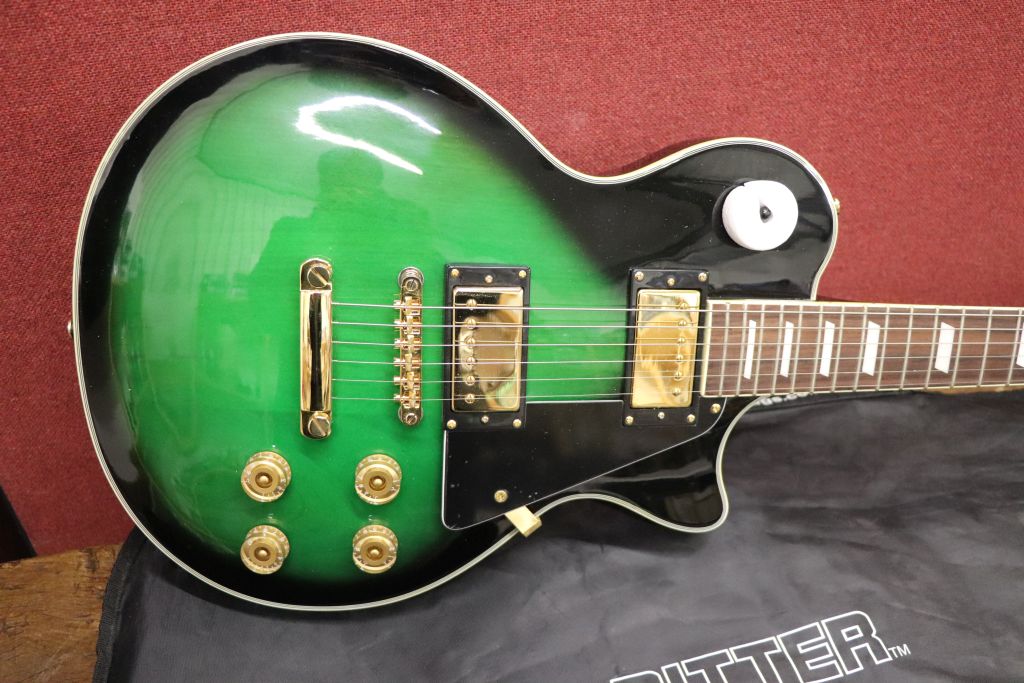Guitar Axl Les Paul style electric guitar in green, new and unused