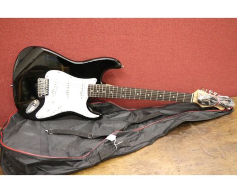Guitar - A Stagg strat style electric guitar in black.  New and unused.  Comes with soft case.