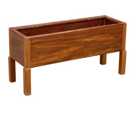 A Danish Mid Century teak planter. 76x26x38cm 