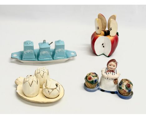 A collection of Mid 20th Century cruet sets etc. A Goebel pottery cruet set. An apple butter knife holder 14cm. 2 Royal Winto