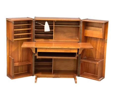 A Mummenthaler and Meier Mid Century teak ‘Magic Box’ folding desk. Open 168x73x114cm. Closed 84x54x114cm   12 