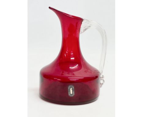 A Ruby Glass jug designed by Geoffrey Baxter for Whitefriars. 12x17cm 