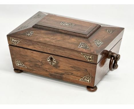 A Regency rosewood and Mother of Pearl sarcophagus shaped sewing box. Early 19th Century. Circa 1810. 33.5x20.5x14cm. 