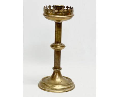 A late 19th century brass church candlestick. 31cm 