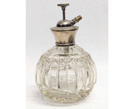 A sterling silver topped perfume bottle by W. G. Sothers Ltd. Birmingham, 1921-1961. 14cm 