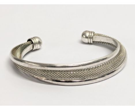 A silver bangle. 29.51g 
