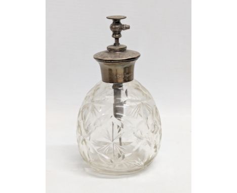 A sterling silver topped perfume bottle. 14cm 