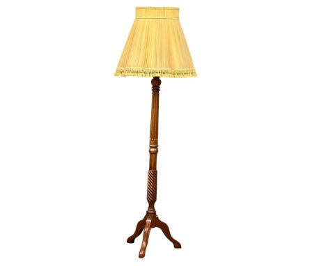 A mahogany standard lamp. 175cm 