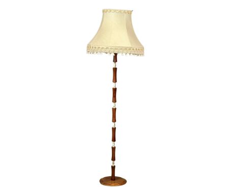 A Mid Century teak standard lamp. 174cm 